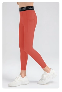 Detail view of boys athletic leggings with a side pocket and GRADE UP waistband