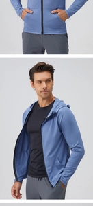 Detail of grey-blue zip-up sports jacket and athletic shorts on a male fitness model