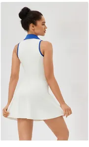 Rear view of slim fit white tennis dress with blue contrast trim and A-line skirt