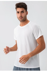 Close-up of white breathable honeycomb fabric on men's raglan sleeve sports t-shirt
