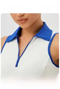 Close-up of white tennis dress showing blue polo collar and zipper closure detail
