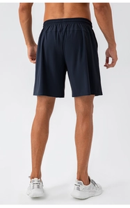 Rear view of dark blue quick-dry sports shorts showing elastic waistband and fabric fit