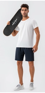 Detail view of quick-dry white sports t-shirt and blue training shorts on male model