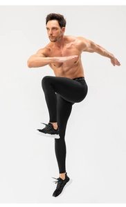 Men's athletic compression leggings featuring elastic logo waistband and breathable fabric