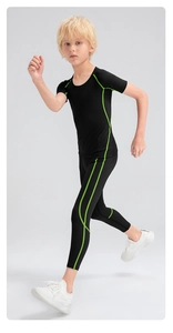 Close-up of boys sports compression set featuring neon green stitching and quick-dry fabric