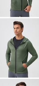 Detail view of olive green men's athletic zip-up hoodie featuring secure side pockets