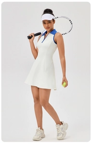 Detail of a white athletic tennis dress with a blue polo collar and sleeveless armholes