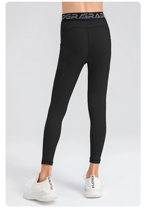 Detail of high waist sports leggings with UPGRADE elastic waistband and contoured stitching