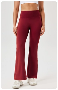 Detail view of wine red flare yoga pants with high waist and breathable stretch fabric