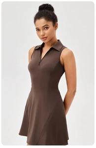 Detail of coffee brown tennis dress featuring a functional half-zipper and classic polo collar