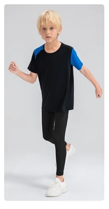 Detail of boys' breathable quick-dry athletic leggings featuring high elasticity for sports