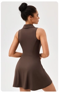 Detail view of chocolate brown tennis dress showing slim fit back and flared hemline
