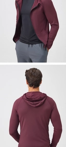 Detail view of burgundy men's sports jacket featuring full zipper and quick-dry fabric