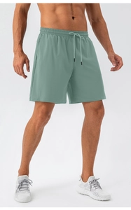 Detail of men's quick-dry sports shorts with elastic waist and adjustable drawstring