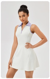Detail of white tennis dress showing lavender collar trim and zipper on dry-fit fabric