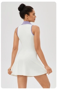 Back view of a white tennis dress with purple contrast lapel and an A-line silhouette