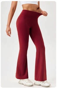 Detail shot of high-waisted flared yoga pants showing tummy control and elasticity