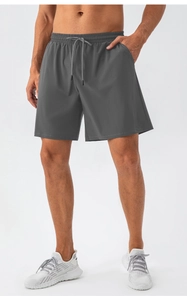 Close-up of men's dark grey quick-dry shorts with drawstring elastic waistband