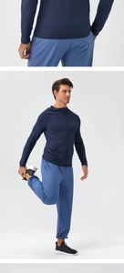 Close-up of flexible elastic fabric on men's navy blue quick-dry hooded sports jacket