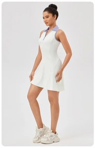 Detail view of the contrasting polo collar and zipper on white sleeveless tennis dress