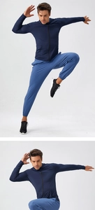 Close-up of men's quick-dry hooded jacket and pants set showing high-stretch fabric elasticity