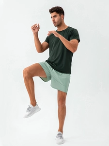 Men's quick-dry sports set with dark green textured tee and light green gym shorts