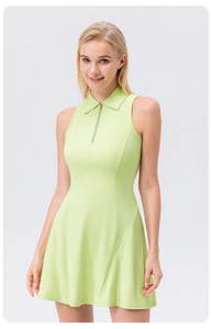 Detail view of the pale green tennis dress featuring a zipper collar and sleeveless design