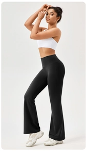 Full-body shot of high-waisted black yoga flare pants with a slimming elastic fit