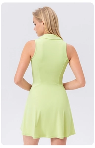 Rear view of lime green A-line tennis dress showing a fitted back and polo collar