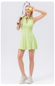 Detail of light green tennis dress featuring a zip-up lapel collar and A-line silhouette