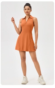 Athletic tennis dress with polo collar, metal zipper, and pleated skirt in caramel orange