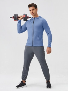 Men's light blue hooded sports jacket and dark grey joggers set for gym training