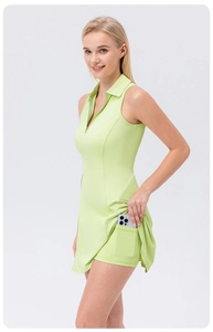 Detail showing inner shorts pocket for phone on light green high-waist yoga tennis dress