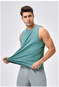 Detail of teal breathable athletic tank top showing fabric elasticity during workout