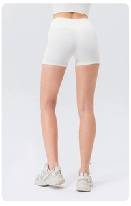 Close-up back view of white high-waisted yoga shorts with seamless compression fit