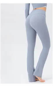 Detail view of high-waisted flared yoga pants with butt-lifting and body-shaping features