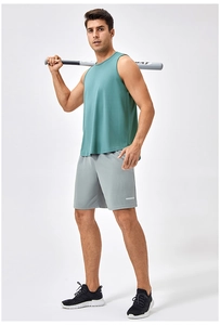 Men's loose dark green quick-dry fitness tank top paired with grey sports shorts