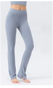 Detail showing the inner slit hem design on high waist yoga pants for leg elongation