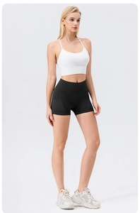 Detail of high waisted black yoga shorts with ergonomic side stitching for fitness