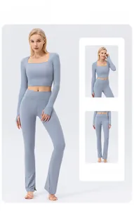Detail view of light blue yoga set featuring thumbhole cuffs and high waist flared leggings