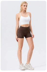 Detail view of high-waist yoga shorts with side pocket stitching and elastic fabric