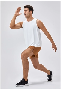 Detail view of white quick-dry fitness tank top showing side slit and breathable fabric