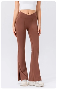 Front view of brown yoga flare pants with V-cross high waist and side slit details