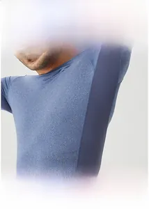 Detail view of men's athletic shirt featuring breathable mesh splicing and blue texture