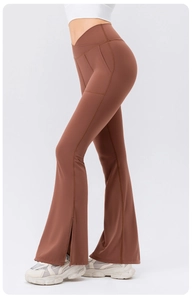 Detail of high waist brown yoga flare pants with side pockets and split hems