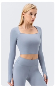 Detail of square neck yoga top with thumb holes and high waist leggings in blue-grey