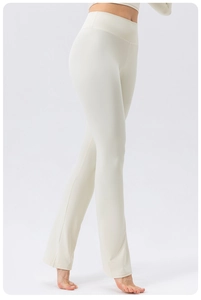 Detail view of high-waisted flared yoga pants with tummy control and elegant cream fabric