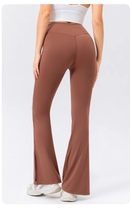 Rear view of high-waist yoga flare pants in caramel with v-shaped stitching and side slits