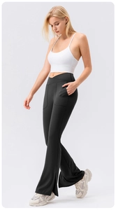 Detail of high waisted crossover yoga pants with functional side pockets and flared leg