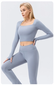 Detail of light blue square neck yoga top with thumb holes and matching high waist leggings